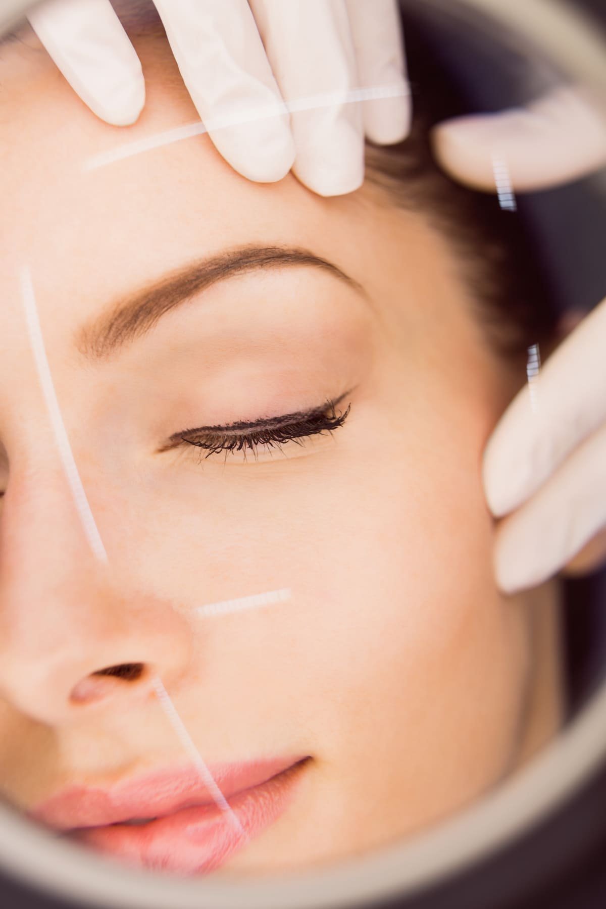 dermatologist examining female patient skin 1